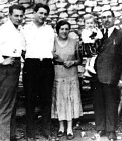 Sender Przedecki [far right]. Possibly with new child from his second marriage, and his new wife next to him. The other two men unidentified. Most likely taken in Klodawa, 1938/9 behind No. 10 Rynek, his home and tailoring shop.