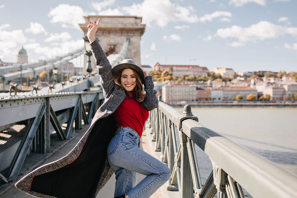 carefree-girl-blue-jeans-happy-dancing-architecture-background.jpg