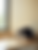 A close up view of a German Shepherd dog as it looks up at the viewer from a blanket.