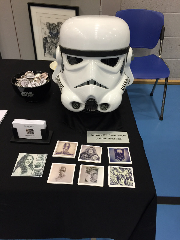 IGABFAT: Custom trooper helmet as constructed by Emma Brassfield, along with some badges and a set of small square prints.