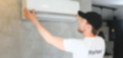 Man servicing an air-conditioning unit