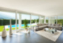 Photo of a living room with pool in background