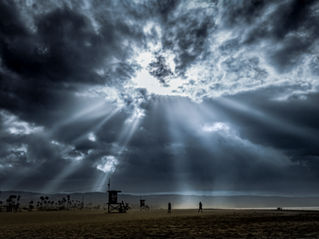 Storm clouds and vivid sunset over Newport Pier, California