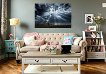 Expansive sky and ocean wall art displayed in a cozy coastal-themed living room