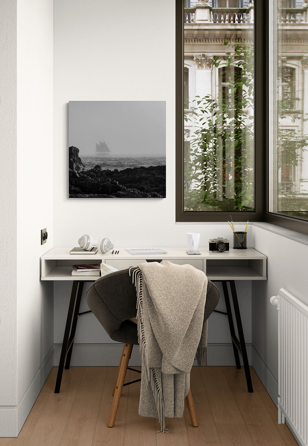 Thumbnail: Coastal monochrome wall art hung above a compact desk with a view of lush greenery outside.