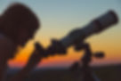 Young woman looking at the sky with astronomical telescope..jpg