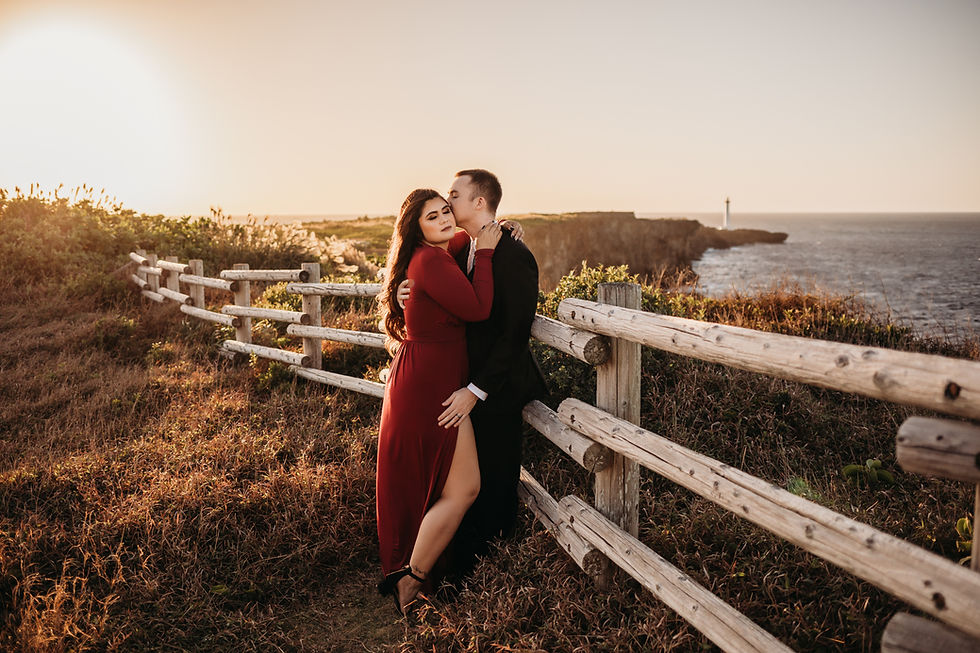 sunset couples session romantic red dress lighthouse cliff