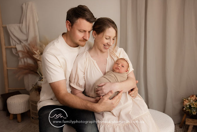 One week old baby with Mum and Dad during Brisbane family and baby photography session
