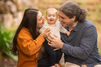 family smiling at toddler at outdoor photography session in Brisbane with Natarsha March