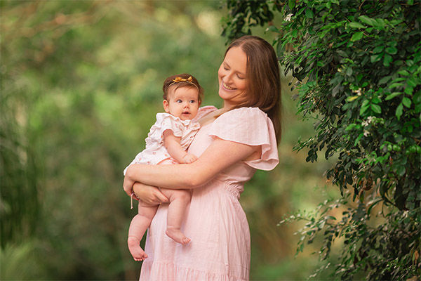 Mum holding baby during family photography session Brisbane
