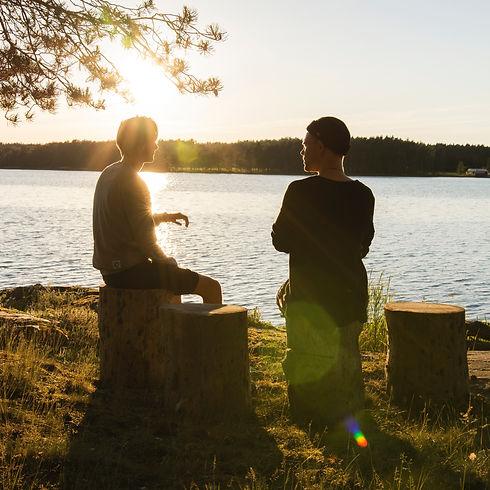 man in black jacket standing beside body of water during sunset_edited.jpg