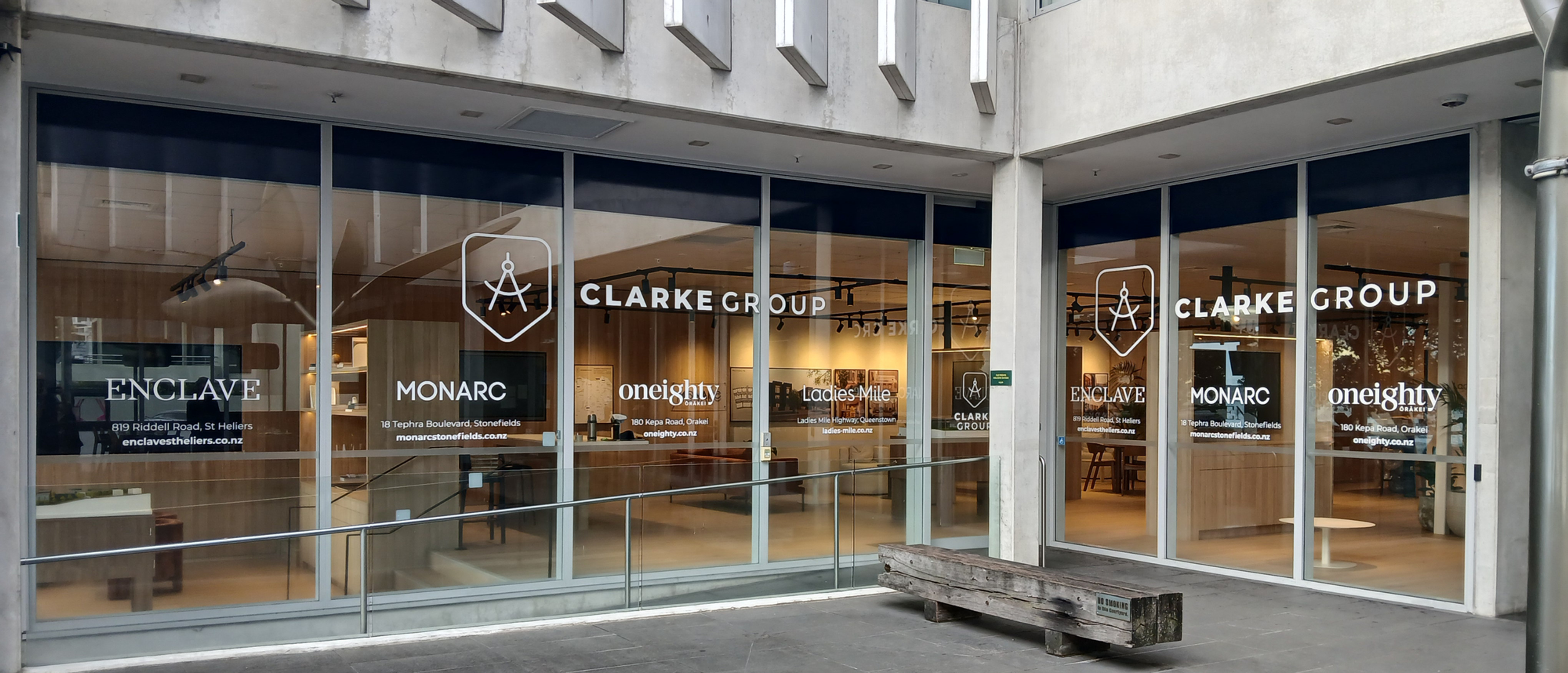 Eye-level view of a modern shopfront with clear branding and signage