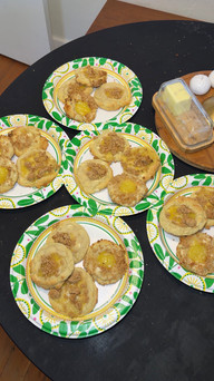 multiple paper plates filled with lemon bar cookies