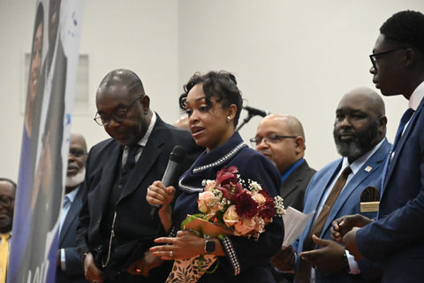 Our first lady giving a speech for our bishop