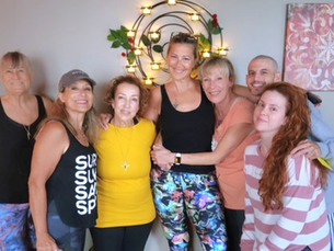 Community members gathered inside West Door Yoga studio during opening weeks in Bay Shore NY
