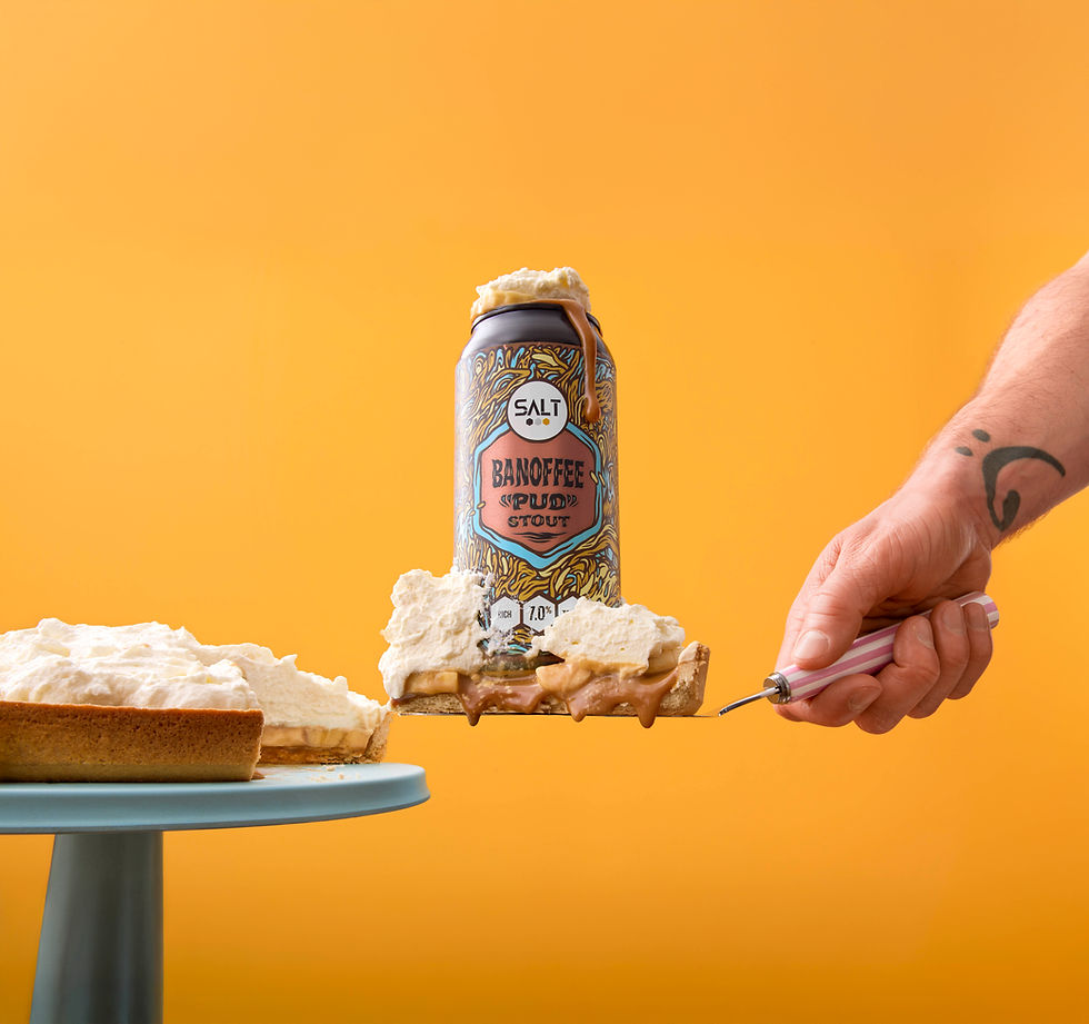 Creative product photography of Salt Banoffee Pudd Stout styled as a banoffee pie dessert with whipped cream, photographed by advertising photographer Richard Jarrett, London.