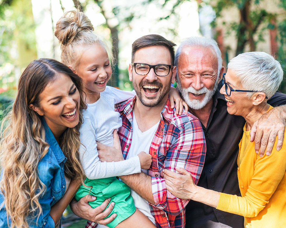 Group of people smiling outdoors in a friendly, diverse community setting