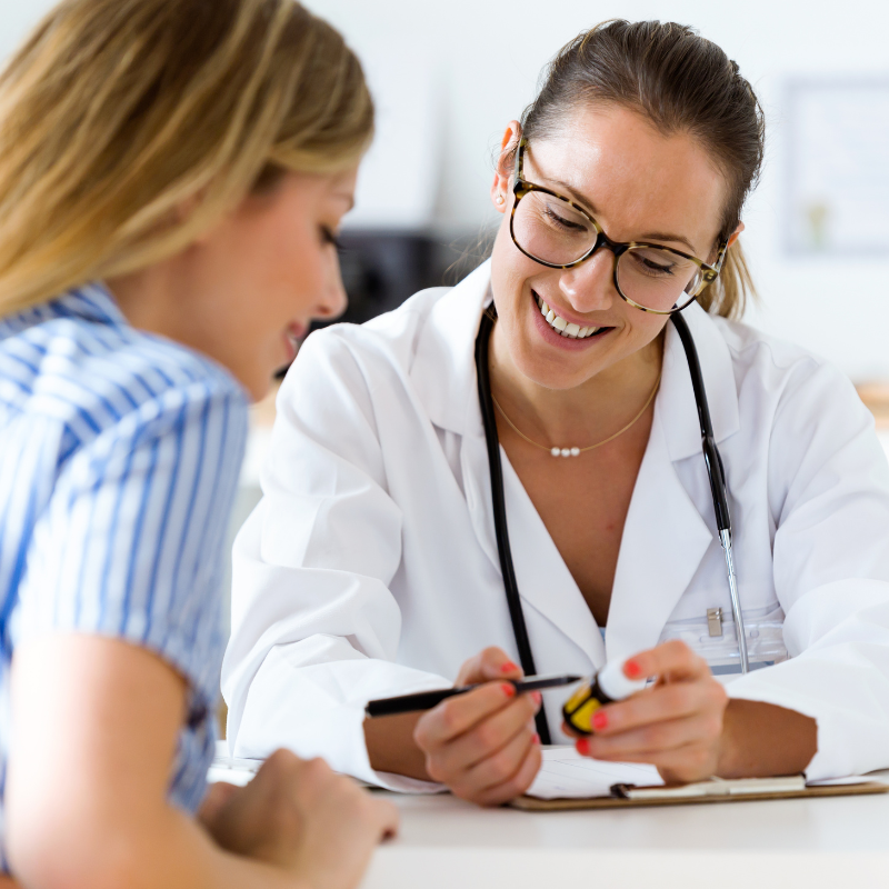 Pharmacist speaking with a patient during a consultation