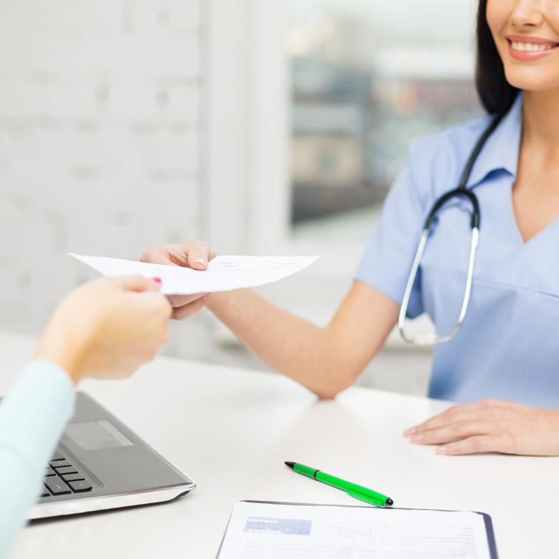 Pharmacist reviewing a patient’s chart to support prescription extension services