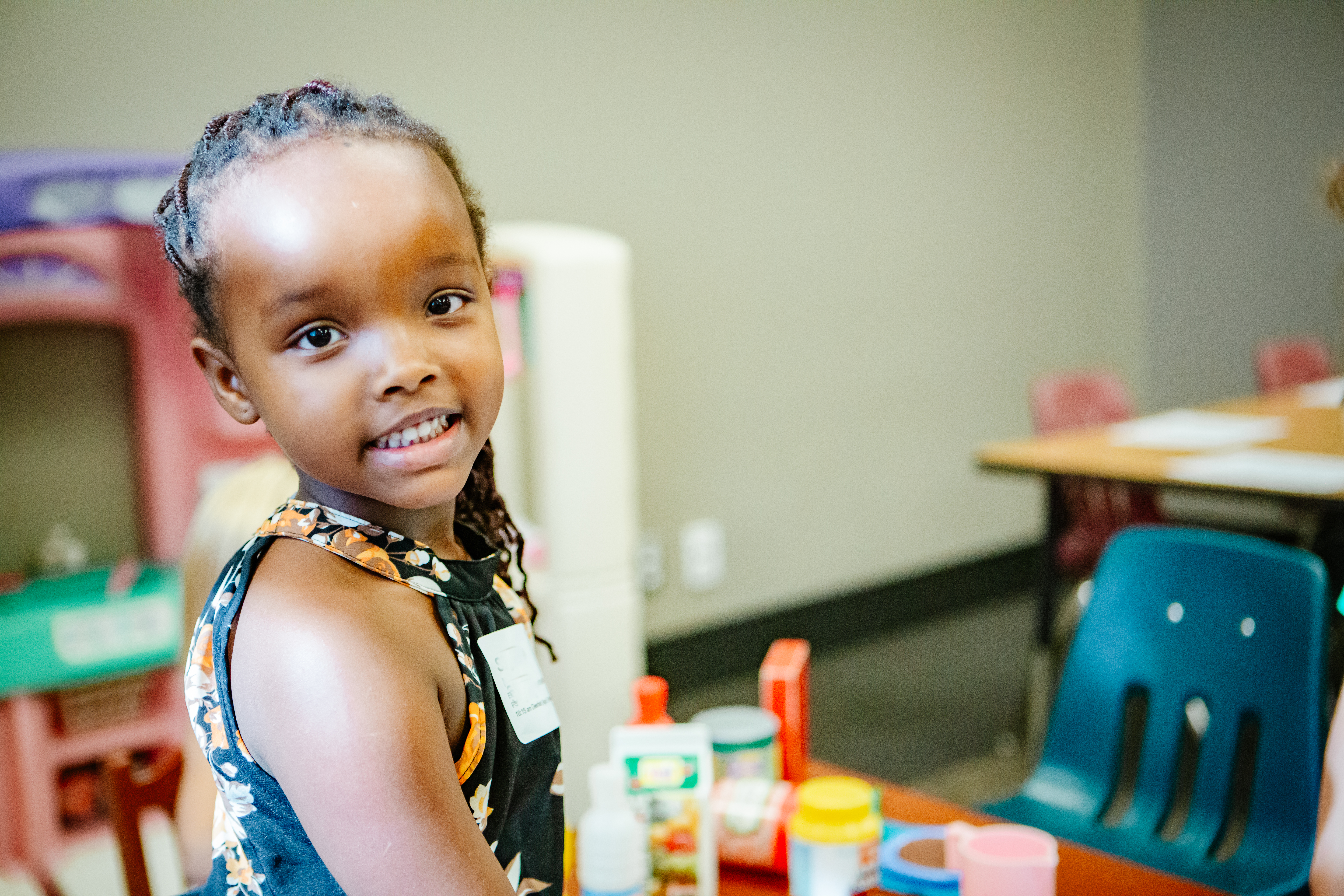 Child looking over and smiling
