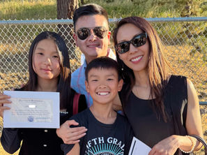 Judy Sin with her husband and two children at their daughter's middle school graduation ceremony in Moraga—celebrating a proud milestone as a family in their East Bay journey.