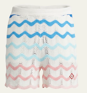 Casablanca Men’s Crochet Wave Stripe Shorts featuring vibrant multicolor wave patterns, drawstring waist, and breathable open-knit construction, perfect for upscale summer styling with a playful twist.
