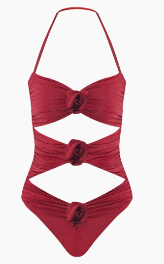 Maygel Coronel Lantana cut-out one-piece swimsuit featuring sculptural side openings, dramatic gathered detailing, and a bold asymmetrical neckline for a striking resort look