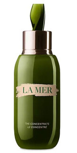 La Mer The Concentrate in a sleek green glass bottle with silver applicator, a luxury serum known for soothing sensitivity and strengthening the skin barrier.