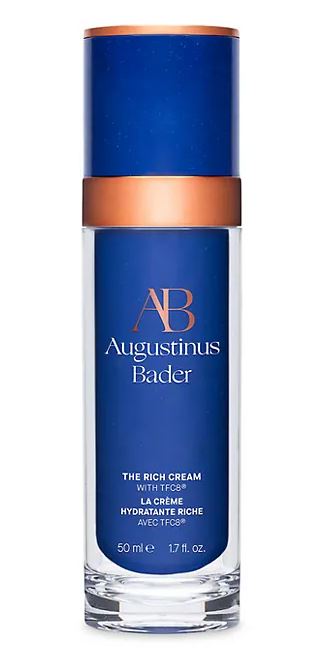 Augustinus Bader’s The Rich Cream in a sleek blue bottle, a luxury moisturizer known for deep hydration and celebrity-approved anti-aging results.