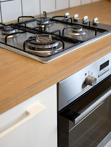 vecteezy_mock-up-gas-stove-in-the-minimal-style-kitchen-with-white_24255403.jpg
