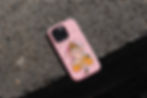 Pink phone cover with a cartoon image of Ganesha, the Hindu god