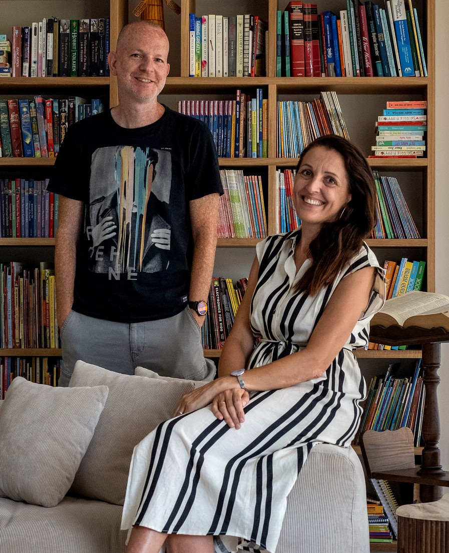 Rebecca and Ilan Citrin, the team behind Citrin Design, in a home library setting