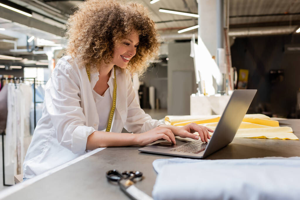 A small shop owner checking her Wix e-commerce notifications.