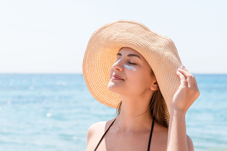 beautiful-young-woman-hat-is-applying-sunblock-her-eyes-her-nose-like-indian-sun-protectio