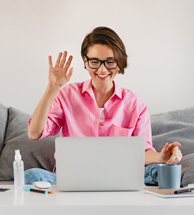 smiling-woman-pink-shirt-sitting-relaxed