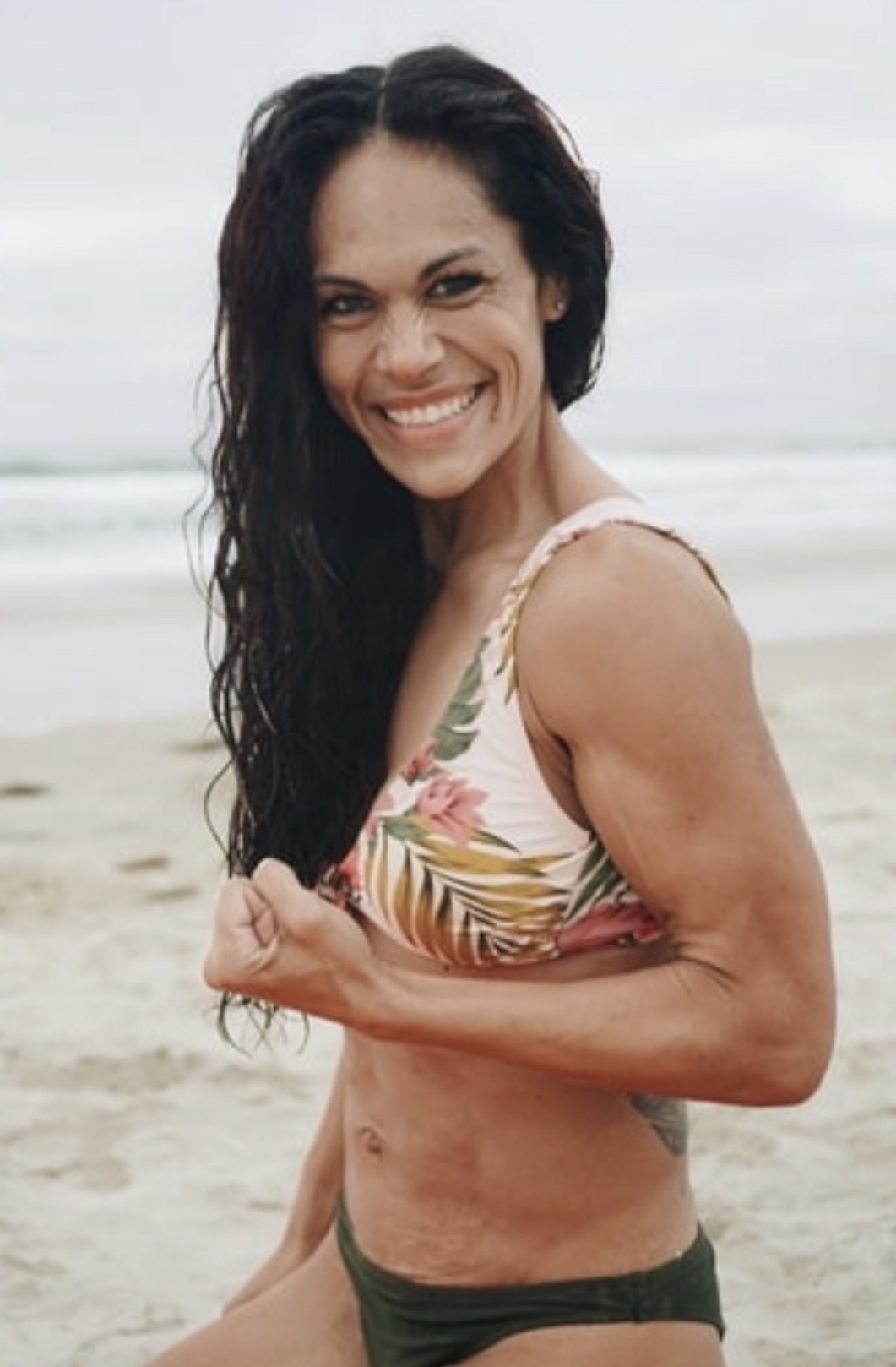 Dr. Stefanie smiling on the beach
