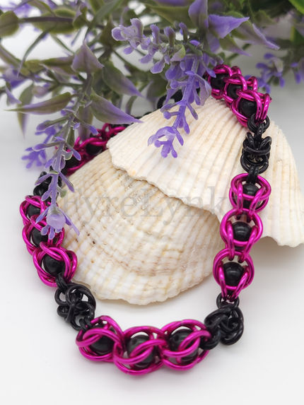 Pink and black captured bead chainmail bracelet