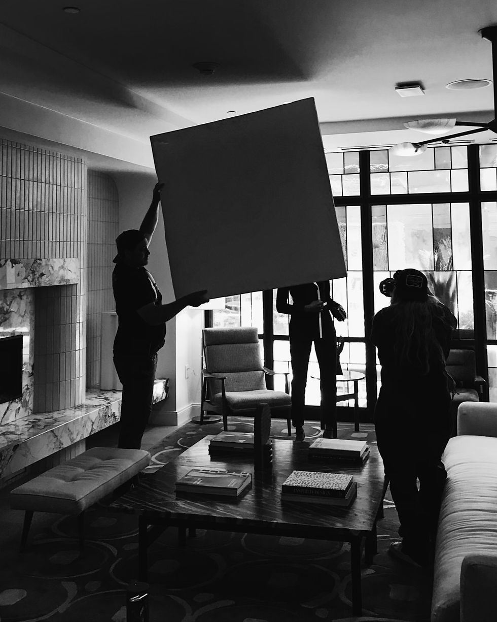 Black and white photo of photographer and crew on set