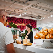 A foodstuffs barista helping guest