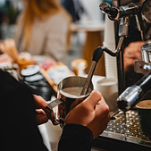 Milk being steamed by a Foodstuffs barista for a drink
