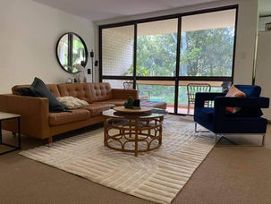 Correct rug placement under furniture