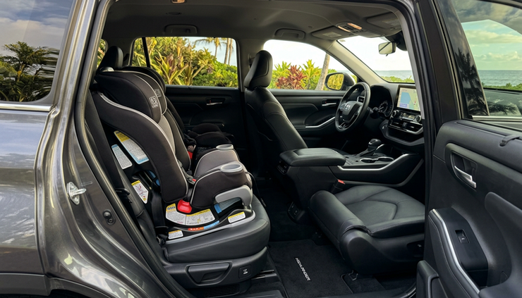 Wide-angle view of a clean family car interior with child seats after detailing