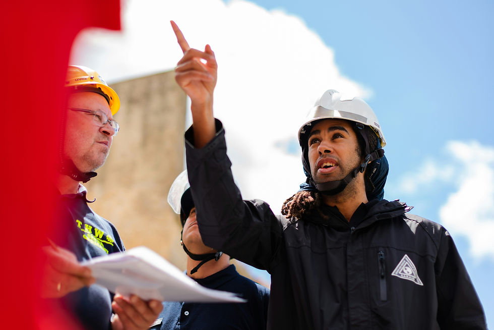 Home inspector examining a house exterior and foundation with a clipboard, highlighting key inspection checkpoints for Quebec buyers.