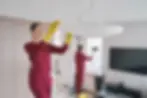 Team of professional cleaners doing eco-friendly housecleaning