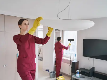 Team of professional cleaners doing eco-friendly housecleaning