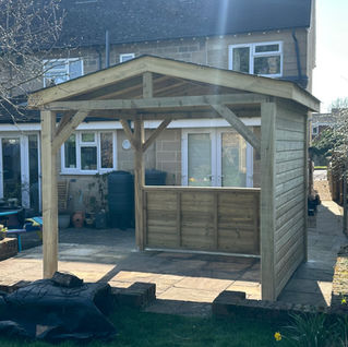 Apex gazebo with bitumen roofing shingles built for the BBQ