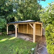 Wooden gazebo with 125mm posts and full height rear panels.