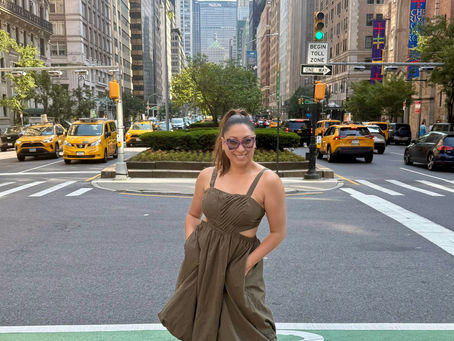Giselle Samson standing in New York City, reflecting on her journey as a performer and creator during her years of living in the city.