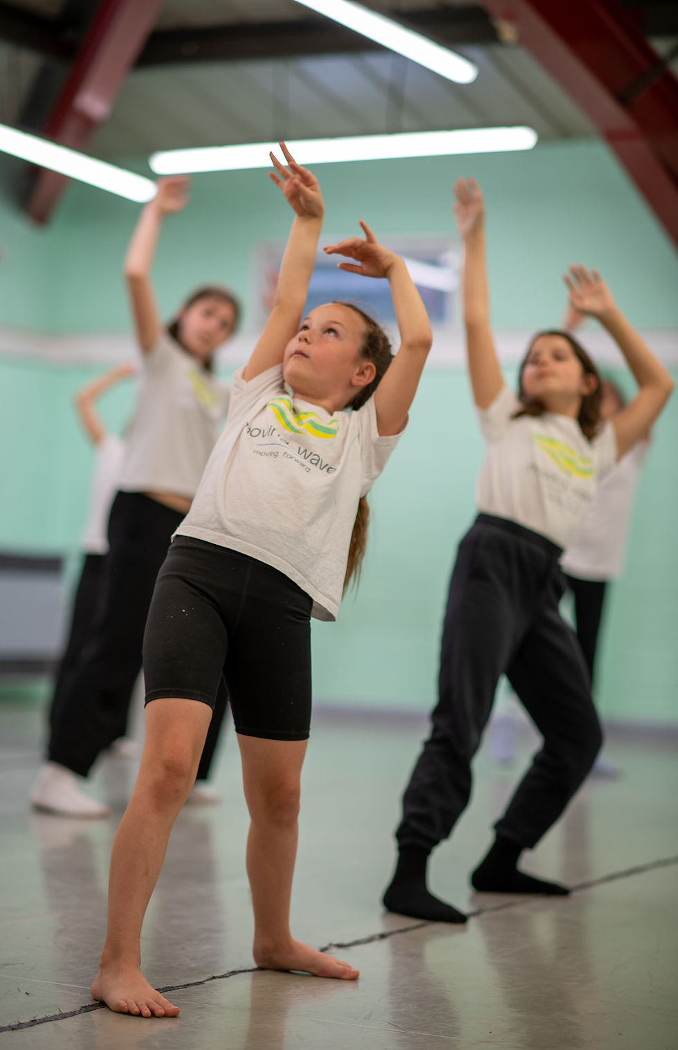 Children taking part in a contemporary dance class at Moving Waves, Whittington Park Community Centre, Archway. Weekly performing arts classes for kids aged 4+, including Street Dance, Ballet, Break Dance, and Contemporary.