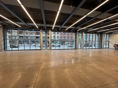 Large interior space overlooking street level entrance via Renlita Bi-Fold doors.